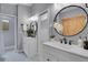 Stylish bathroom with double vanities, modern fixtures, and a window with a mountain view at 79 Beaver Rd, Idaho Springs, CO 80452