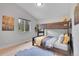 Cozy bedroom featuring a bunk bed, natural light from the window, and light wood floors at 79 Beaver Rd, Idaho Springs, CO 80452