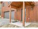 Inviting entryway with wood columns, stylish lighting, and a convenient garage access at 79 Beaver Rd, Idaho Springs, CO 80452