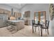 Modern kitchen with a large island, stainless steel appliances, and bright, airy dining area at 79 Beaver Rd, Idaho Springs, CO 80452