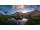 Stunning mountain view reflected in the lake with lush vegetation and snow capped peaks at 79 Beaver Rd, Idaho Springs, CO 80452