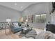 Bright living room featuring vaulted ceilings, large windows, and a cozy fireplace at 79 Beaver Rd, Idaho Springs, CO 80452