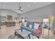 Open-concept living space with high ceilings, stylish furnishings, and seamless kitchen access at 79 Beaver Rd, Idaho Springs, CO 80452