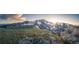 Expansive mountain vista featuring snow-capped peaks and a bright sunburst at 79 Beaver Rd, Idaho Springs, CO 80452