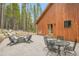Backyard patio with outdoor table and fire pit, ideal for entertaining and relaxing at 79 Beaver Rd, Idaho Springs, CO 80452