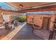 Backyard patio with a deck, garden area, and brick elements for outdoor enjoyment at 537 N Logan St, Denver, CO 80203