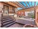 Backyard patio with a multilevel deck, awnings, and comfortable seating for relaxation at 537 N Logan St, Denver, CO 80203