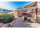 Backyard patio with an awning, seating, and garden features a perfect outdoor living space at 537 N Logan St, Denver, CO 80203
