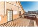 Private balcony with a fenced perimeter and a mix of materials used for construction at 537 N Logan St, Denver, CO 80203