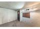 Unfinished basement space offering potential for customization, featuring textured walls at 537 N Logan St, Denver, CO 80203