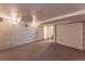 Unfinished basement showing the utilities, textured walls and access to another room at 537 N Logan St, Denver, CO 80203