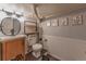Stylish bathroom with modern fixtures, vanity, decorative wallpaper, and elegant lighting at 537 N Logan St, Denver, CO 80203