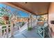 Inviting front porch featuring comfortable seating, a porch swing, and hanging flower baskets, creating a cozy outdoor space at 537 N Logan St, Denver, CO 80203