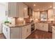 Bright kitchen featuring granite countertops, stainless steel appliances, mosaic backsplash, and wooden floors at 537 N Logan St, Denver, CO 80203