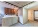 Functional laundry area with washer, dryer, and cabinets for storage solutions at 537 N Logan St, Denver, CO 80203