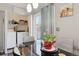 Comfortable dining area with a glass table, and access to the laundry area, offering convenience at 765 Mockingbird St, Brighton, CO 80601