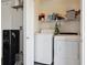 Dedicated laundry area features modern appliances and plenty of storage space, ideal for organization at 765 Mockingbird St, Brighton, CO 80601