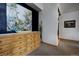 Hallway with a wooden dresser and artwork, leading to other areas of the home at 31332 Island Dr, Evergreen, CO 80439