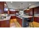 Spacious kitchen with modern cabinetry, stainless steel appliances, a center island, and natural light at 31332 Island Dr, Evergreen, CO 80439