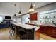 Kitchen with an island and bar seating, stainless steel appliances, and natural light from windows at 31332 Island Dr, Evergreen, CO 80439