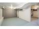 Spacious unfinished basement with painted floor and walls offering ample storage or creative space at 3242 N Albion St, Denver, CO 80207