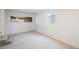 Finished basement area with new carpet, neutral paint, and natural light at 3242 N Albion St, Denver, CO 80207