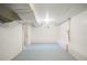 Unfinished basement with painted floor and walls offering ample storage or creative space at 3242 N Albion St, Denver, CO 80207