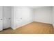 Bright bedroom with modern flooring and two convenient closets for ample storage at 3242 N Albion St, Denver, CO 80207