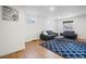 Bright living room with hardwood floors, modern furniture, and ample natural light, creating an inviting space at 3242 N Albion St, Denver, CO 80207