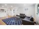 Bright living room with hardwood floors, modern furniture, and ample natural light, creating an inviting space at 3242 N Albion St, Denver, CO 80207