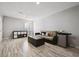 Finished basement featuring laminate flooring, mini fridge and lounging area at 1124 E 130Th Ave # C, Thornton, CO 80241