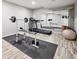 Finished basement featuring exercise equipment and laminate flooring at 1124 E 130Th Ave # C, Thornton, CO 80241