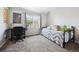 Bedroom with large window, neutral paint, and desk at 1124 E 130Th Ave # C, Thornton, CO 80241