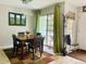 Dining area with stylish lighting, outdoor views, and seating for four at 1124 E 130Th Ave # C, Thornton, CO 80241