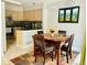 Cozy dining area with modern lighting and a window overlooking the outdoor scenery at 1124 E 130Th Ave # C, Thornton, CO 80241