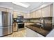 Contemporary kitchen with stainless steel appliances, granite countertops, a stylish backsplash, and ample cabinet space at 1124 E 130Th Ave # C, Thornton, CO 80241