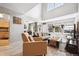Bright open living space features contemporary furnishings, vaulted ceilings and an adjoining kitchen at 1124 E 130Th Ave # C, Thornton, CO 80241