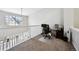 Bright loft space features an office setup with ample light, providing an ideal workspace or study area at 1124 E 130Th Ave # C, Thornton, CO 80241