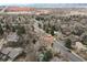 Aerial view showcasing a neighborhood with greenbelt access and tree-lined streets at 2492 S Yarrow St, Lakewood, CO 80227