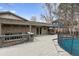 Large wooden deck overlooking backyard, providing an ideal space for outdoor entertaining and relaxing at 2492 S Yarrow St, Lakewood, CO 80227