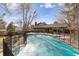 Fenced in pool and spacious backyard offering outdoor living and privacy at 2492 S Yarrow St, Lakewood, CO 80227