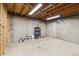 Spacious unfinished basement with concrete walls and small windows, providing ample storage or customization opportunities at 2492 S Yarrow St, Lakewood, CO 80227