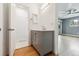 Hall bathroom featuring a modern vanity and access to a separate toilet and shower at 2492 S Yarrow St, Lakewood, CO 80227