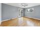 Spacious bedroom with hardwood floors, ceiling fan, slider door to deck, and a window at 2492 S Yarrow St, Lakewood, CO 80227