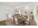 Bright dining room featuring an exposed beam ceiling, an open layout and a large dining table at 2492 S Yarrow St, Lakewood, CO 80227