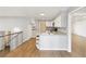 Open-concept kitchen with ample counter space and convenient access to the living area at 2492 S Yarrow St, Lakewood, CO 80227