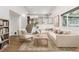 Bright living room featuring neutral tones, stylish furniture, and a modern design at 2492 S Yarrow St, Lakewood, CO 80227