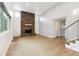 Spacious living room with vaulted ceiling, stone fireplace, and hardwood flooring at 2492 S Yarrow St, Lakewood, CO 80227