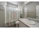 Clean bathroom with shower/tub combo and updated vanity at 8695 Torrey St, Arvada, CO 80007