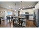 Modern kitchen with stainless steel appliances and granite countertops at 8695 Torrey St, Arvada, CO 80007